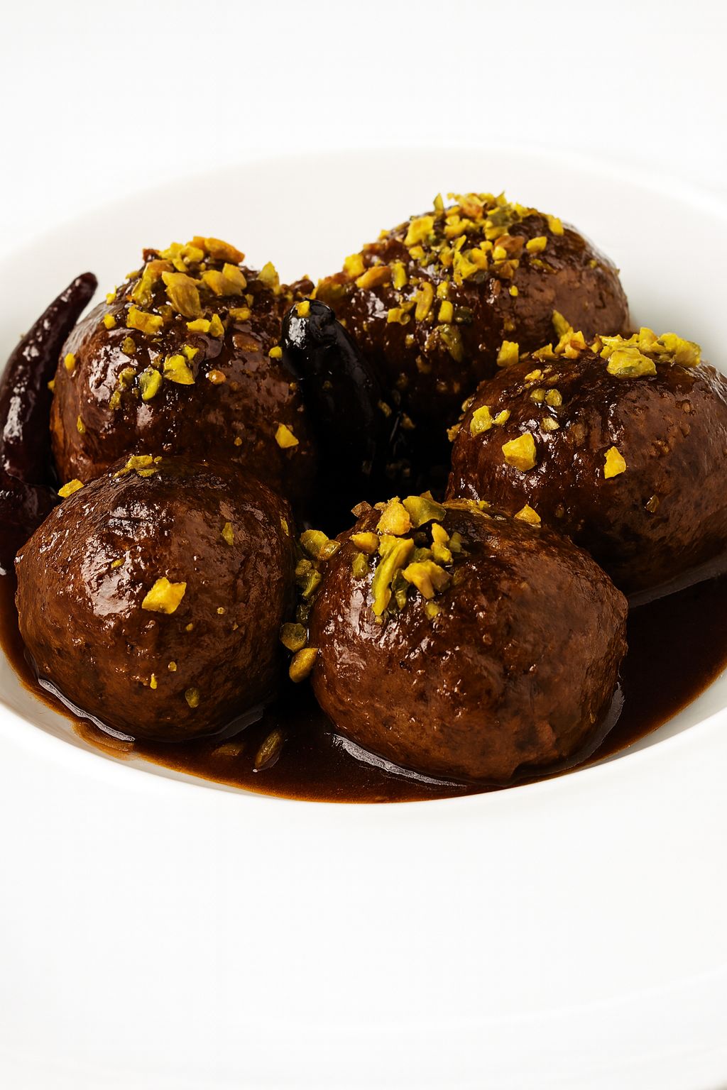 Albóndigas de wagyu, cerdo y embutidos con salsa Marsala y polvo de pistacho (4 u)